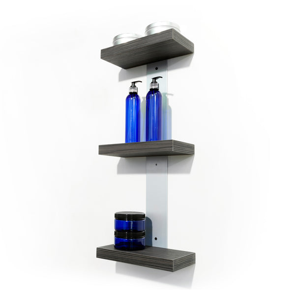 Plank is a wall mounted three product shelf unit with laminate clad wood shelves. Showcase, promote and sell salon product from your stylist stations. Shown in Moon Macassar.