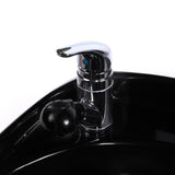 800 pull out style three-in-one faucet shown in chrome finish mounted to a black shampoo bowl.