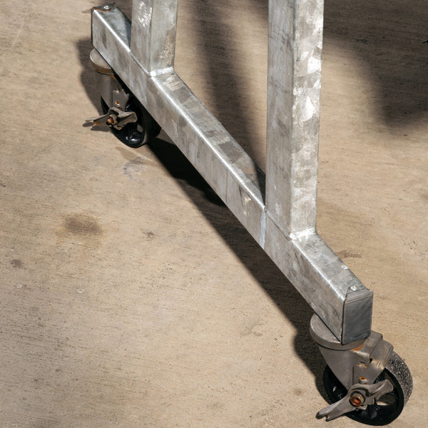 Detailed picture of the galvanized frame and the heavy duty casters that make Blue Streak mobile.  Galvanized/Wenge Sawcut finish.