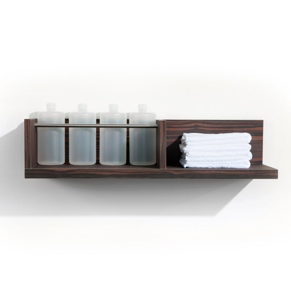 Two Fold is a dual function product dispense and towel shelf for the back bar. It features a laminate clad wood shelf for dry towels and a stainless steel bar retainer for liter bottles. Shown in Jurassic Ebony.